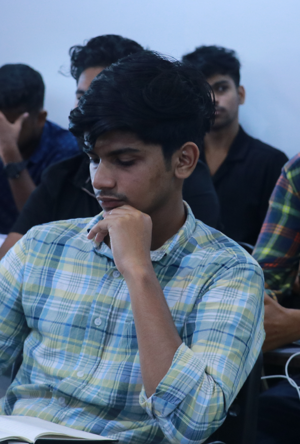 student taking notes at smk | trending stock exchange courses in trivandrum
