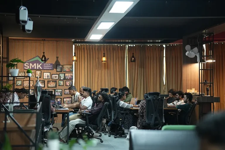 SMK Trading Floor in Kochi with Students and a Monitor for Stock Market Training.
